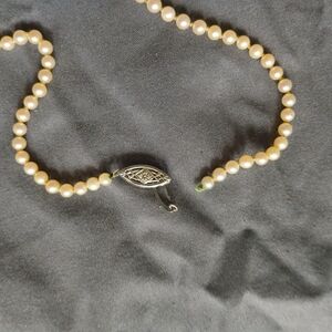 Classic Pearl Necklace with Intricate Silver Clasp